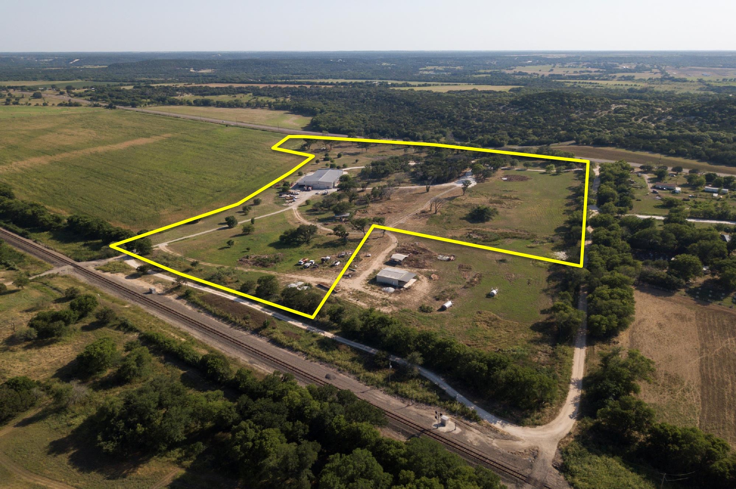 aerial view of the property with yellow boundary lines